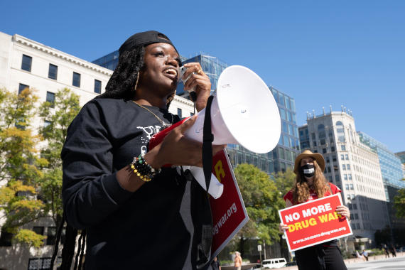 A woman speaking into a megaphone