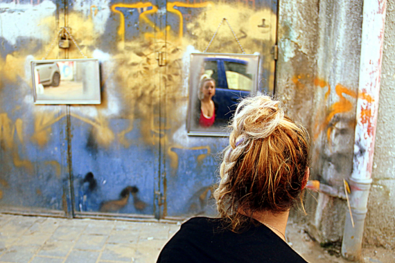 Woman looks at art installation