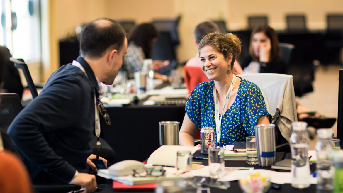 Two people in conversation at Fellowship event