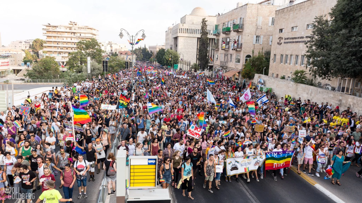 Jerusalem Pride parade with crowd filling city blocks