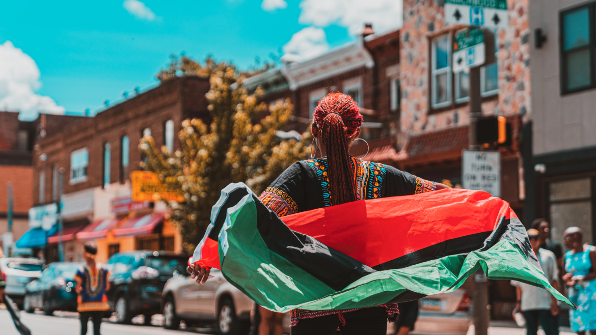 Black woman in street celebration