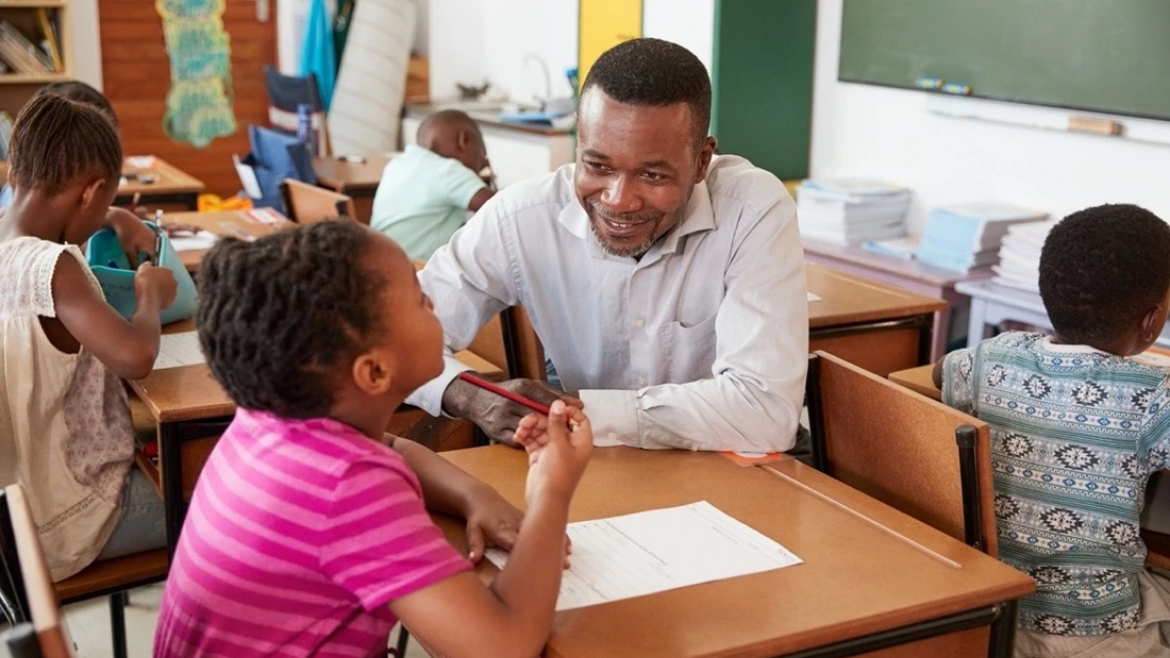 Teacher and grade school student