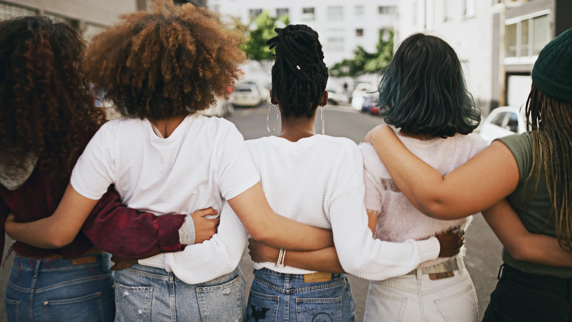 Five women linking arms