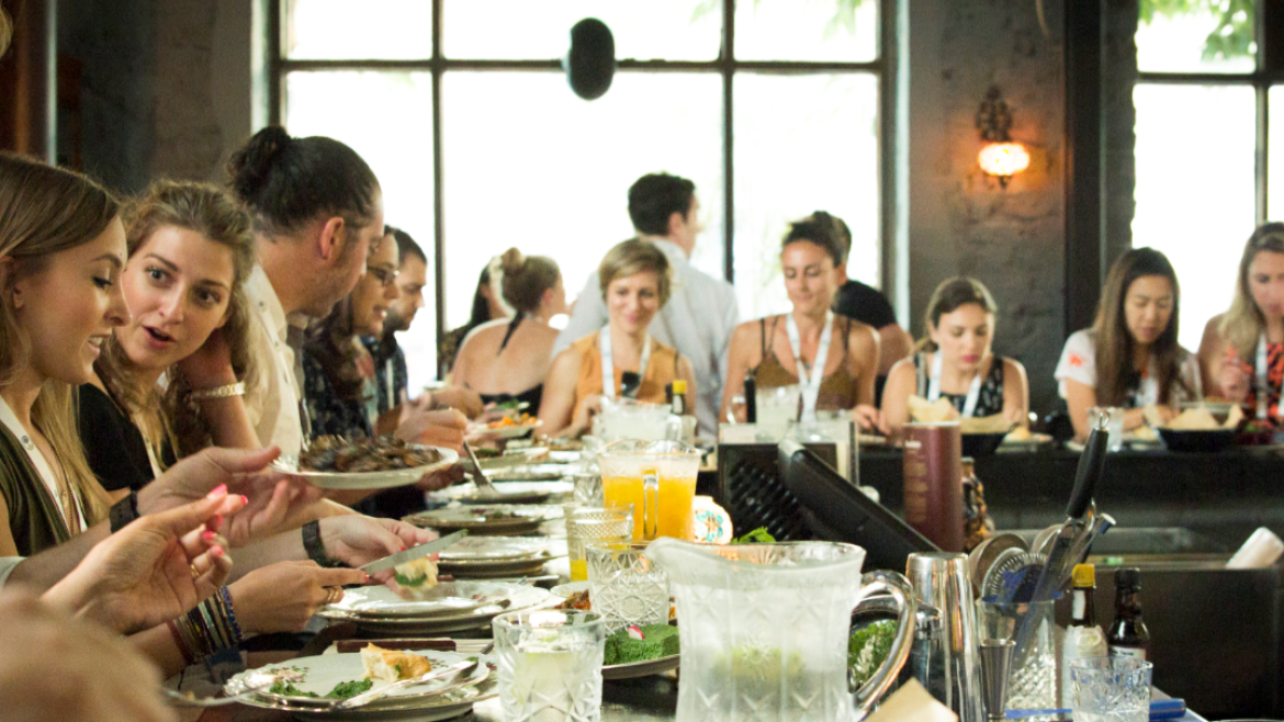 Young adults gathered at a Passover table