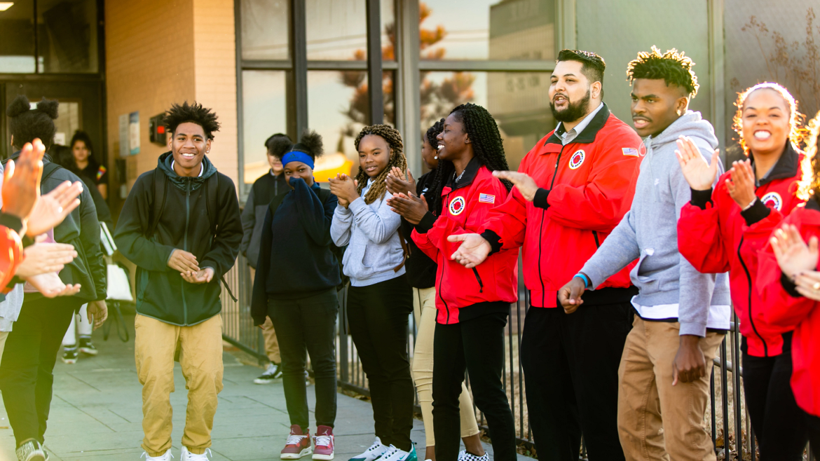 Hometown Tulsa Clapping Outside a Building