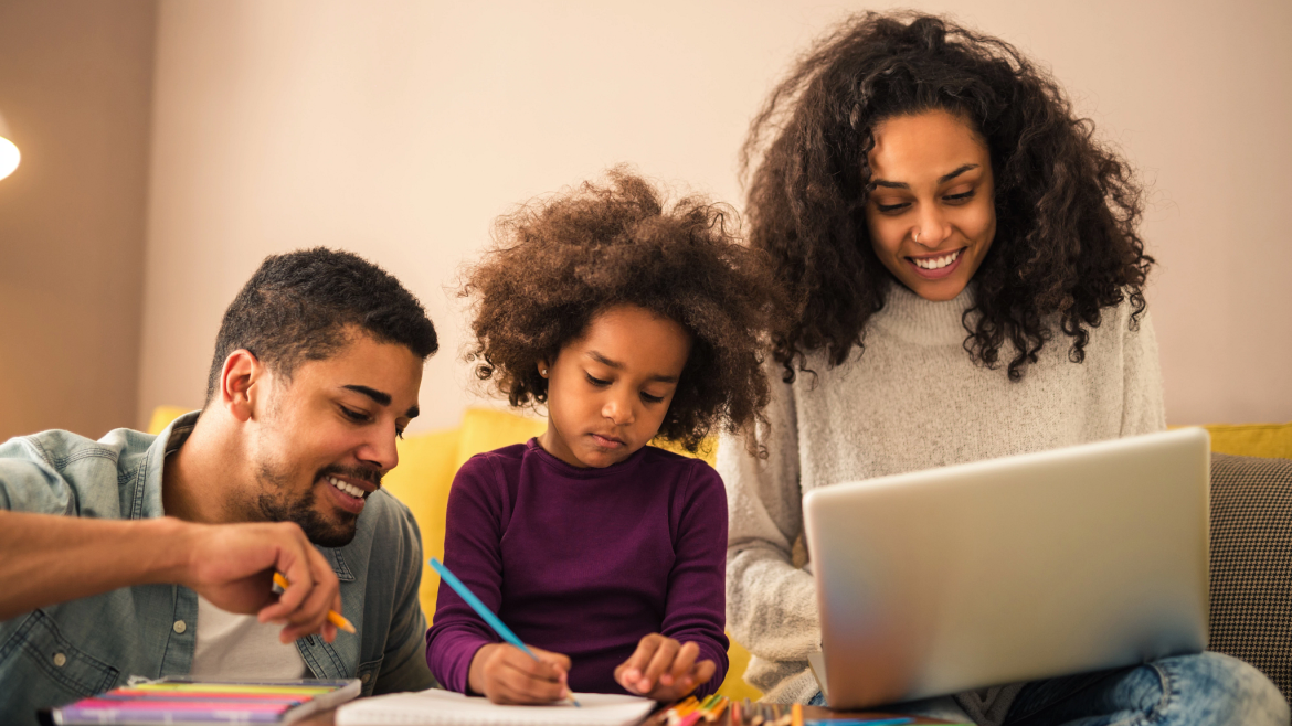 Parents helping daughter with homework