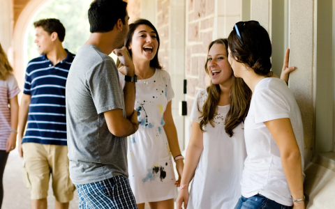 Connecting Jewish students standing around laughing
