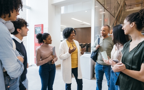 Group of teachers talking - Reach University