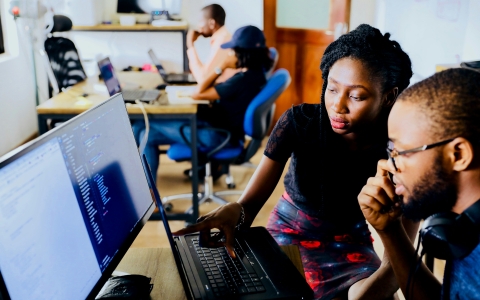 Woman looking at computer - RPPL